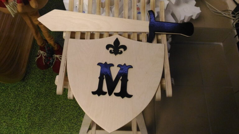 get a free sword and shield vector file for laser cutting